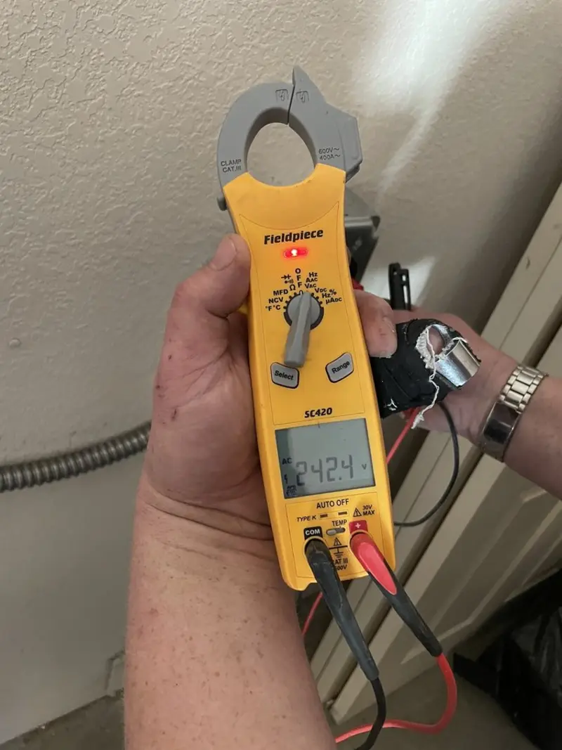 Voltage testing with clamp meter during Generator Installation in Snyder